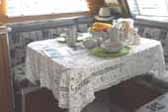 Photo of decorated dining table in vintage 1947 Aero Flite Trailer